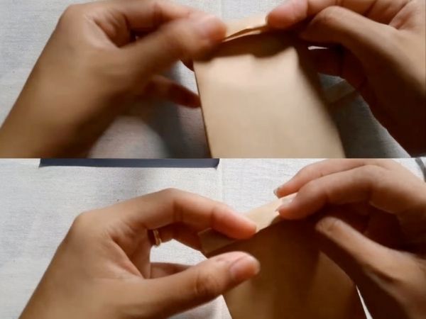 Hướng dẫn cách làm túi giấy đựng quà tặng đẹp, đơn giản tại nhà Gấp miệng túi và gắn quai (nếu cần)